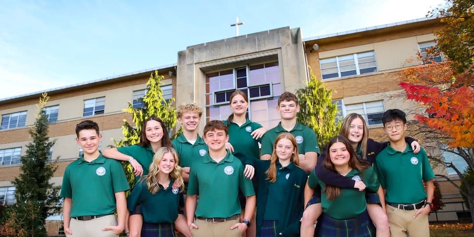 group of Nativity students pictured outside front entrance of school